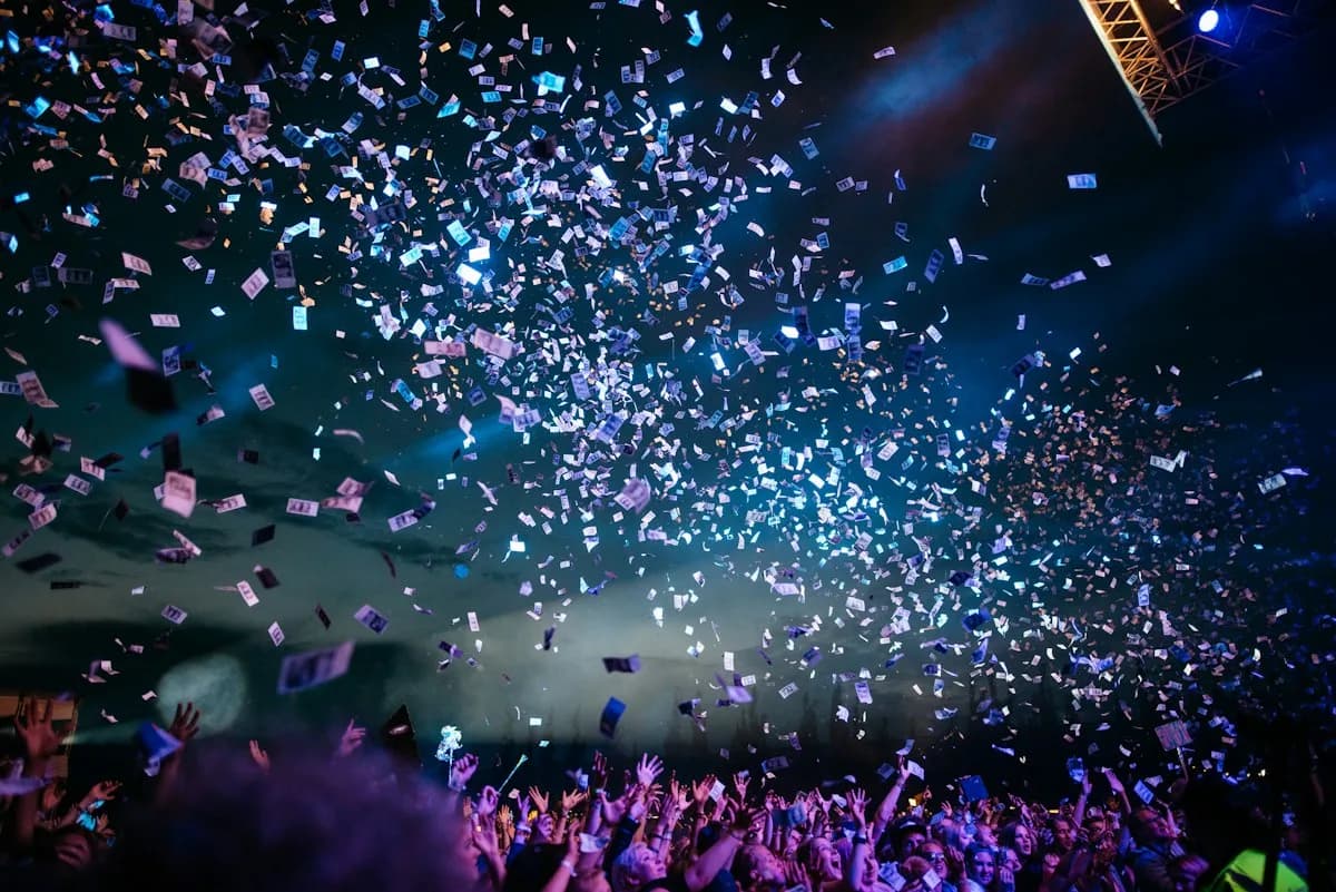 People celebrating together under falling confetti